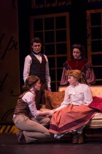 Sisters Jo (Julia Bonnett, lower left) and Amy (Karen Woods Hurt) reconcile after the anger between them nearly led to tragedy, while friend Laurie (Ethan Litt) and sister Beth (Betsy Norton) look on in a scene from "Little Women: The Broadway Musical" at the Booth Tarkington Civic Theatre in downtown Carmel. -- Civic Theatre photo